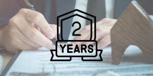 2 years stamped on a photo of a person signing a legal document