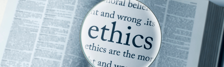the word ethics under a magnified glass