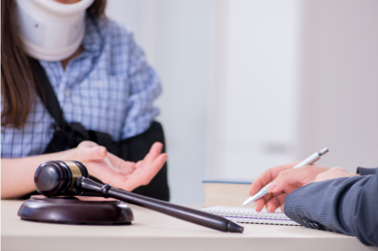 "Injured individual meeting with a trial attorney to discuss compensation and recovery options after a serious accident."